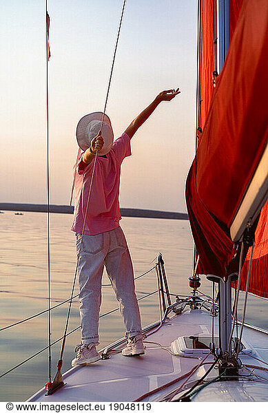Young woman on a sea voyage on a sailing yacht.