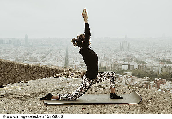 Young woman practicing yoga  asana with hands together.Barcelona