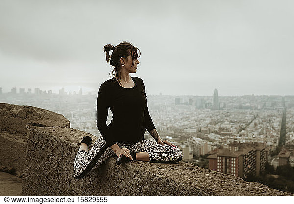 Young woman practicing yoga  stretching.Barcelona