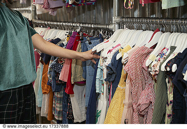 Young woman shopping at clothing store