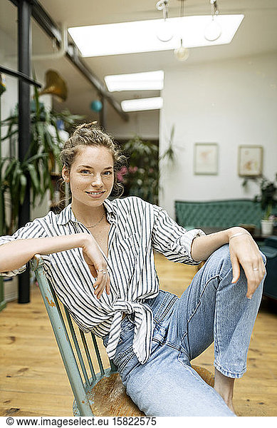 Young woman sitting relaxed on chair