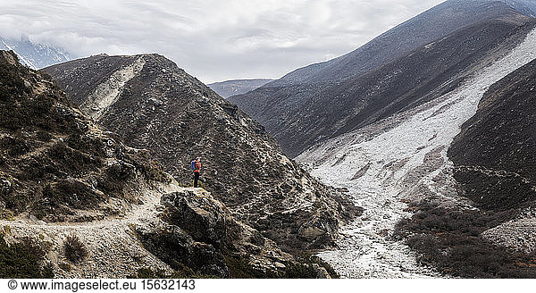 Young woman trekking in the Himalayas near Dingboche  Solo Khumbi  Nepal