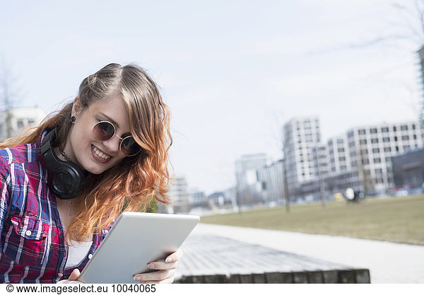 Young woman using a digital tablet  Munich  Bavaria  Germany