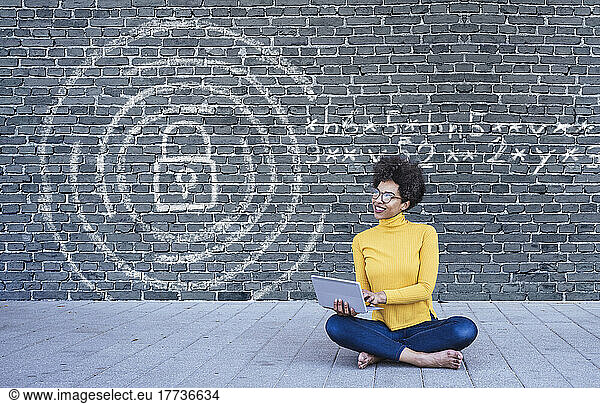 Young woman using laptop with secure internet connection