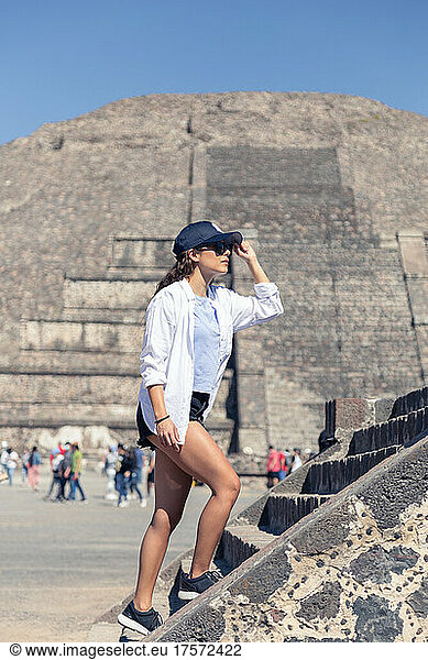 Young woman walking around Teotihuacan archeological site in Mexico