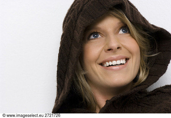 Young woman wearing hooded sweater  portrait  close-up