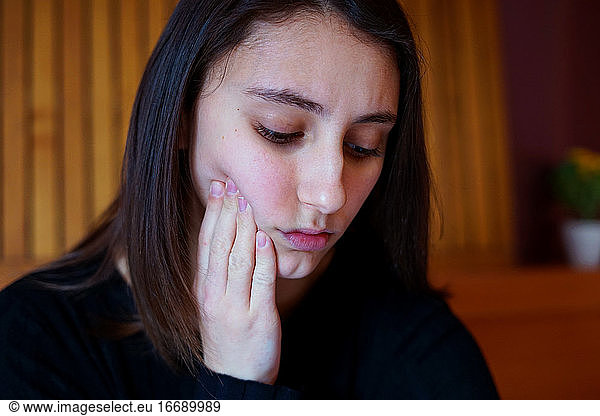 Young woman with toothache. Tooth pain concept.