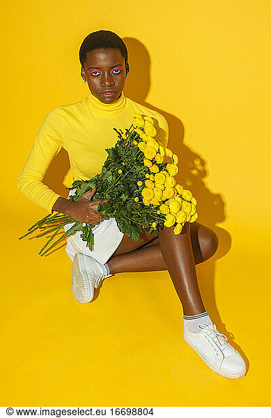 young woman with yellow flowers  total yellow