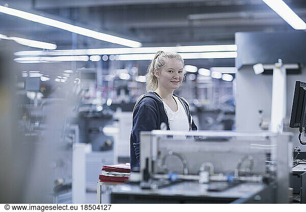 Young woman working in books printing industry  Bremgarten  Hartheim am Rhein  Baden-Wuerttemberg  Germany