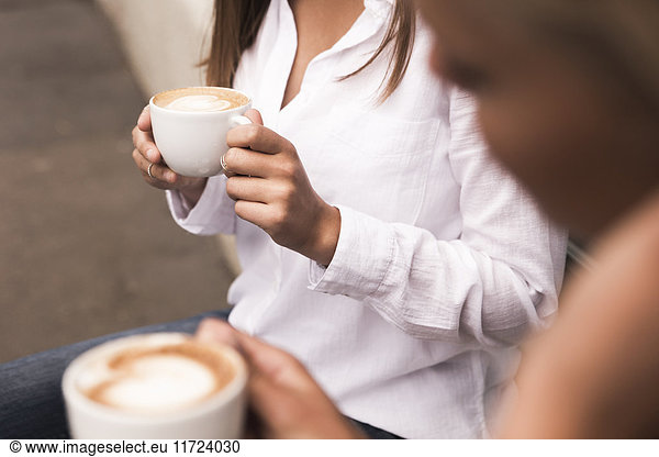 Young women drinking coffee
