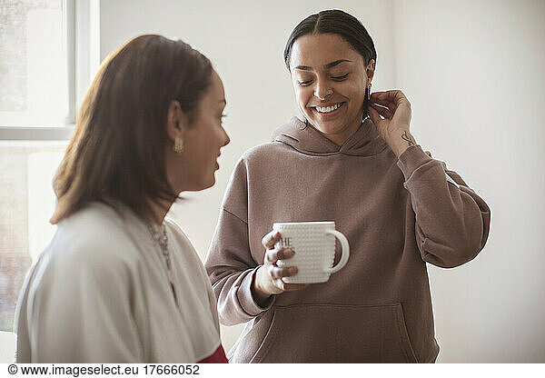 Young women friends drinking tea