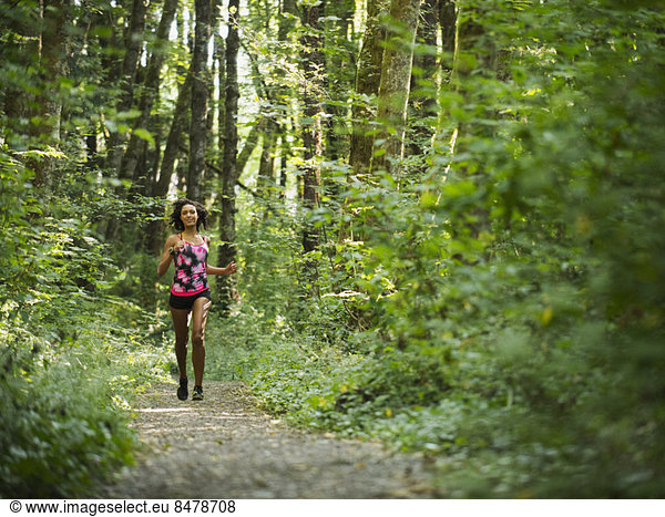 Young women jogging in forest