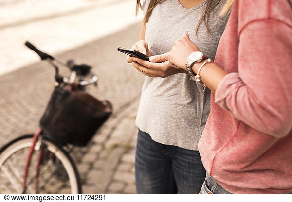Young women using mobile phone