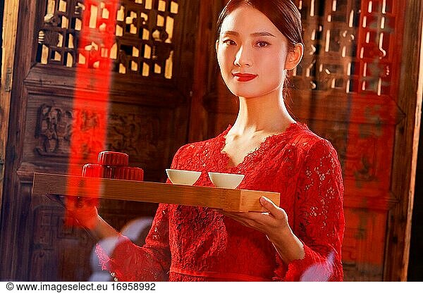 Young women with tea in the New Year