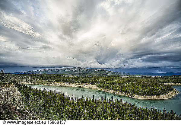 Yukon River with a storm passing overhead while flowing through Whitehorse; Whitehorse  Yukon  Canada