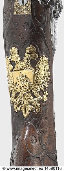 ZIVILE LANGWAFFEN STEINSCHLOSS UND PERKUSSION  Luxus-SteinschlossbÃ¼chse aus einer kaiserlich russischen Gewehrkammer  Marcus Zellner in Wien um 1720. Achtkantiger  mittig leicht eingezogener Damastlauf mit siebenfach gezogener Seele im Kaliber 15 mm. Eingeschobene Messingvisierung. MÃ¼ndung und Laufansatz mit reich eingelegtem  goldenem Banddekor (Einlagen stellenweise unvollstÃ¤ndig). Ãœber der Kammer signiert 'Marcus Zelner'. Fein graviertes Steinschloss mit jagdlicher Szene und widerholter Signatur 'Marcus Zelner in Wienn'. SchÃ¶n verschnittene VollschÃ¤ftung aus Nussbaumholz (kleine Reparatur am Kolben) mit reich profilierter  feuervergoldeter Garnitur mit jagdlichen Szenen zwischen Rankendekor. Der AbzugsbÃ¼gel mit abnehmbarer Handauflage. Auf der Wange eingelegte Windrose in Bein und Ebenholz  Kolben mit Kolbenfach. Daumenplatte aus feuervergoldetem Silber in Form des russischen Doppeladlers. HÃ¶lzerner Ladestock mit Messingdopper. LÃ¤nge 110 5 cm. Provenienz: Sammlung Graf Keller aus St. Petersburg. Die BestÃ¤nde der Sammlung wurden 1920 in Schweden versteigert. Marcus Zellner 1693 - 1758  tÃ¤tig in Salzburg und Wien