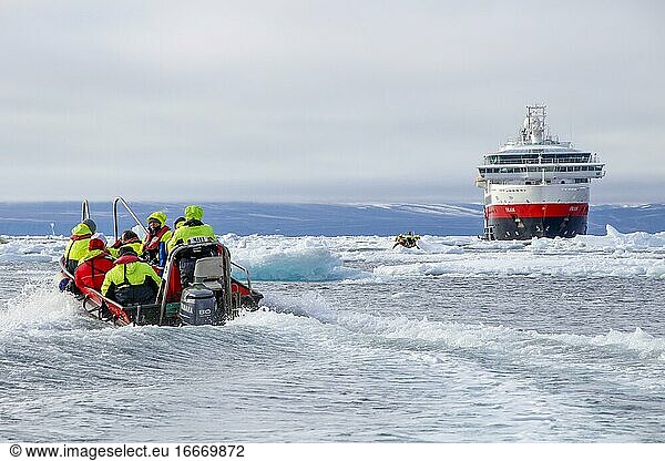 Zodiac dinghy on the way to cruise ship  ice field  cruise  east coast Greenland  Denmark  Europe