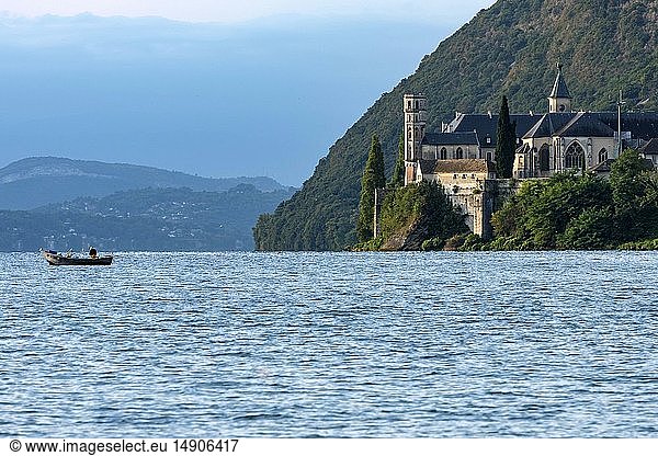 France, Savoie, Le Bourget du Lac, Wild Coast, Professional fisherman setting his nets next to the Royal Abbey of Hautecombe